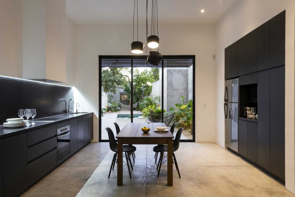 Loft on 72nd Street from Nauzet Rodriguez black kitchen cabinets