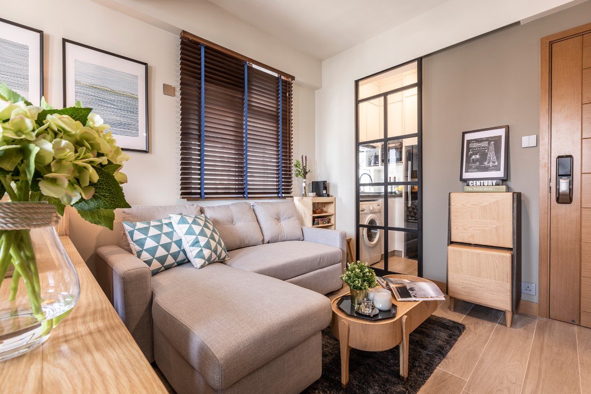 The kitchen is a small and separate room but the sliding glass door helps to open it up toward the living area