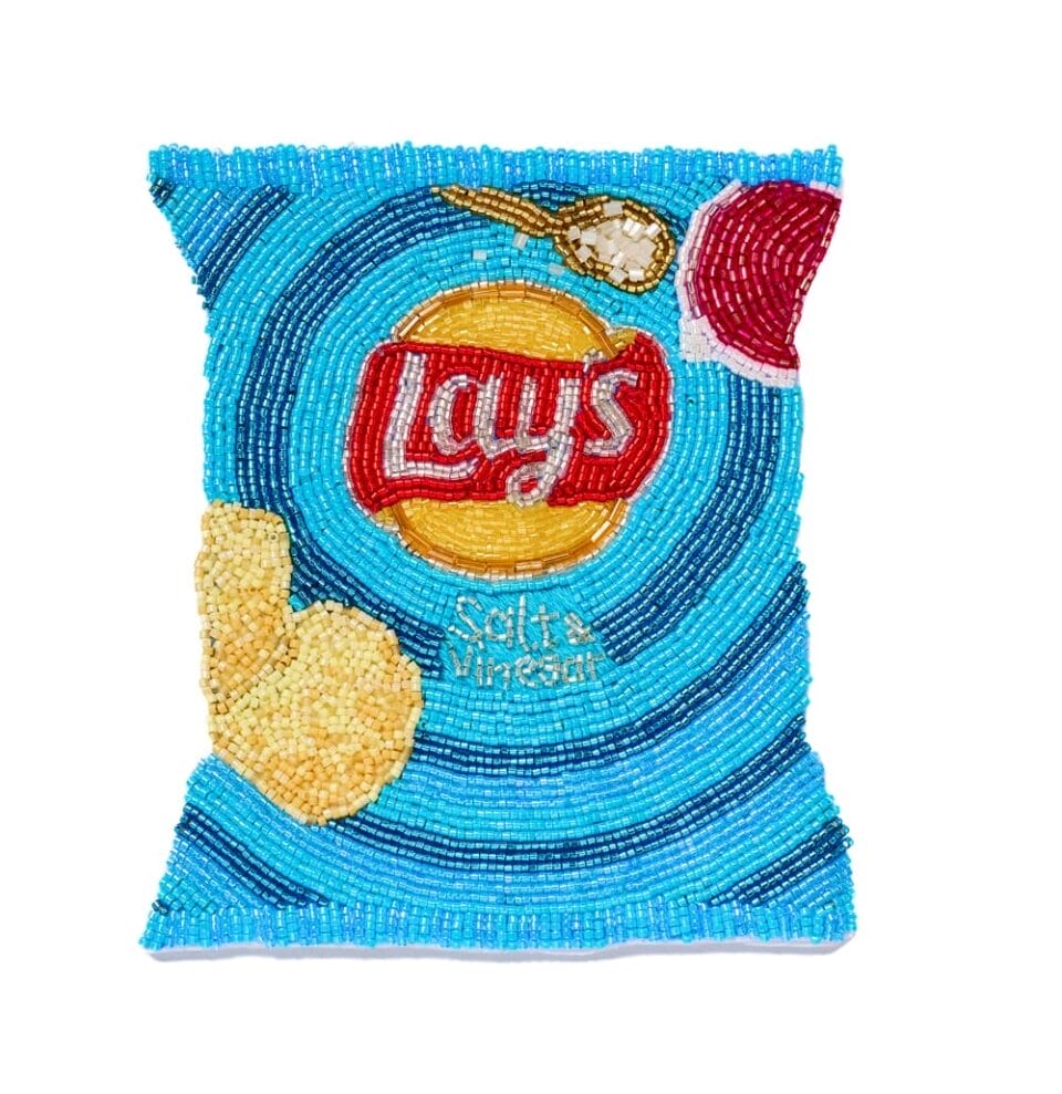 a beaded depiction of a small blue bag of Lay's chips