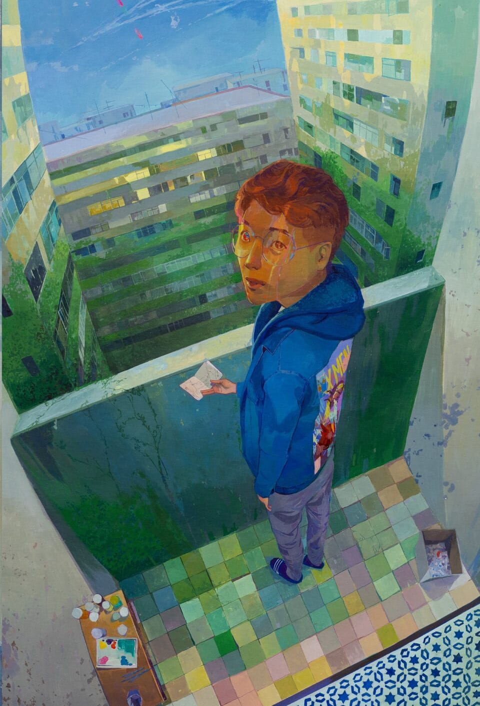 a painting angled down to look at a man holding a small drawing on a balcony that looks out over a courtyard of an apartment building